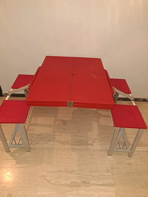 Folding camping table with 4 stools used