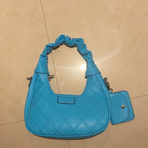 Blue leatherette shoulder bag with multiple compartments