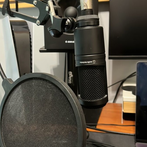 AudioTechnica AT2020 condenser microphone with boom arm and pop filter