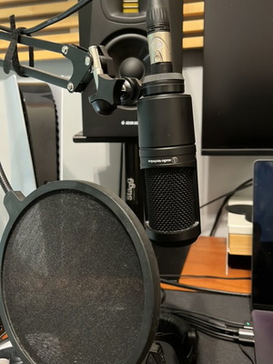 AudioTechnica AT2020 condenser microphone with boom arm and pop filter