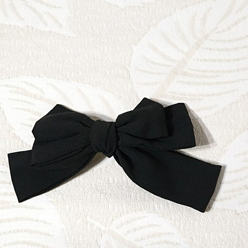 Women's bow hair clip like new, black