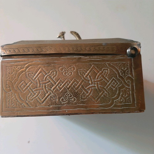 Oriental copper box used with carved decorations