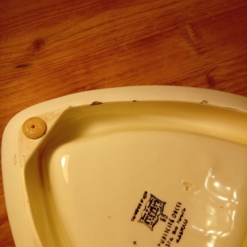 Collectible vintage ceramic ashtray with Benedictine logo used