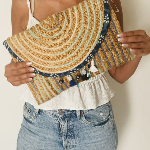Woven clutch bag with ornamental details