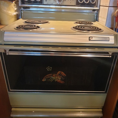 Vintage 1970s home appliance set used, General Electric fridge, Kenmore stove, Ariston washer