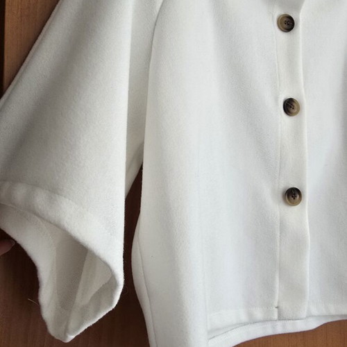 White short jacket with stand-up collar and buttons, minimal style