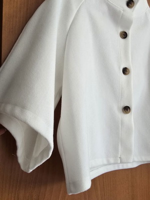 White short jacket with stand-up collar and buttons, minimal style