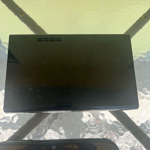 Nintendo Wii U console used with game cartridges and cables