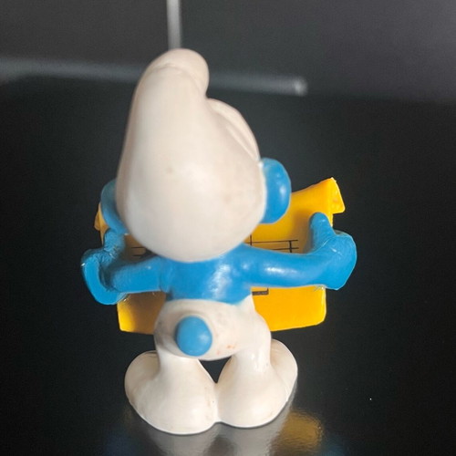 Collectible Smurf figure with musical scroll like new