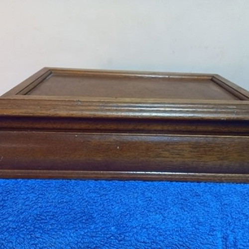 Wooden jewelry box used with velvet-lined compartments