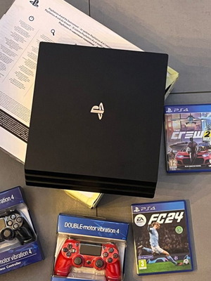PlayStation 4 Pro 1TB console like new with 2 OEM controllers and games