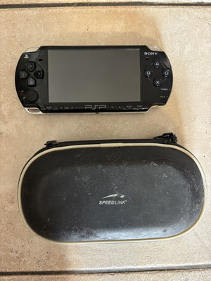 Sony PlayStation Portable PSP 2004 model used, no battery, with Speedlink case