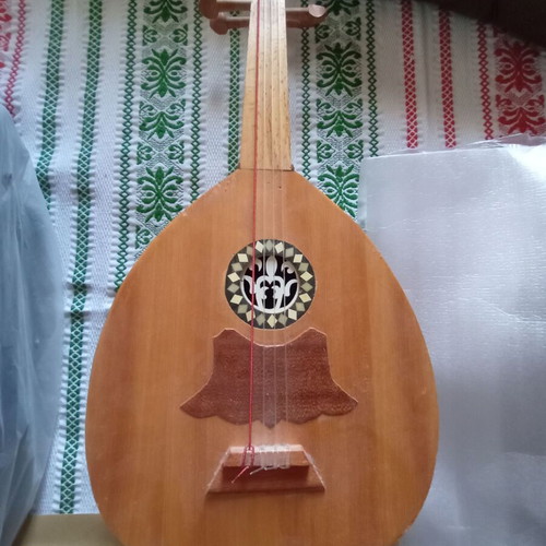 Mini tambouras used, wooden with crack