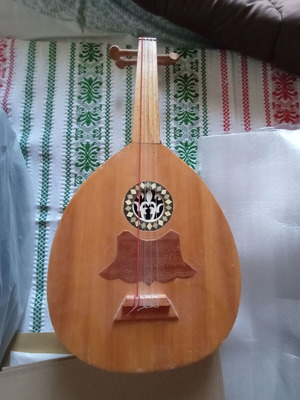 Mini tambouras used, wooden with crack