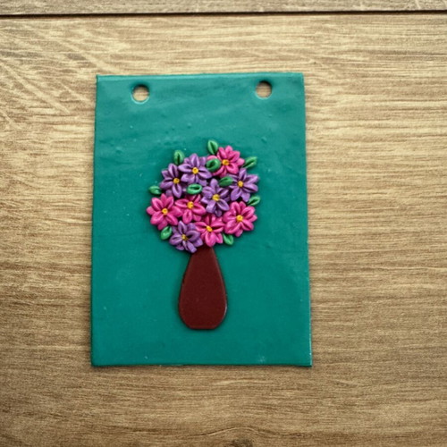 Polymer clay wall hanging with pink and purple daisies and vase like new