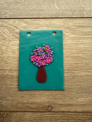Polymer clay wall hanging with pink and purple daisies and vase like new