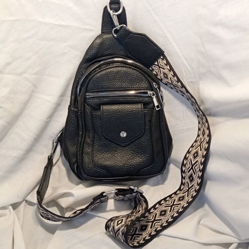 Black Sling Bag Crossbody backpack like new with wide strap and multiple pockets