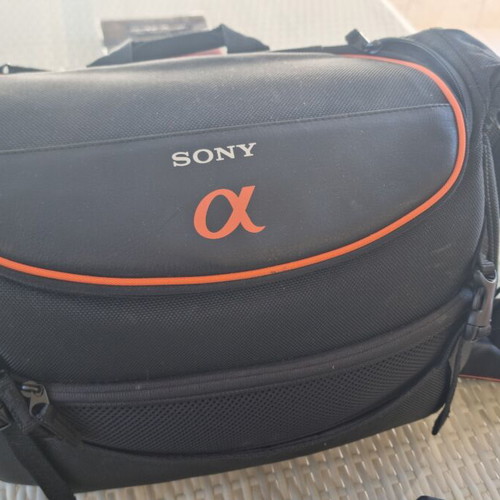 Olympus E-500 DSLR camera used with telephoto lens and case