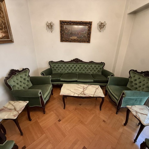 Vintage classic armchair with solid wood and green velvet upholstery