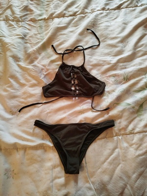 Swimsuit dark green with decorative details like new