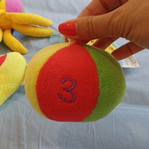 Set of 5 baby toys with octopus, ball, duck, rattle, chicken, and phone