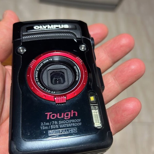 Olympus Tough GPS Camera like new with housing, torch, and base