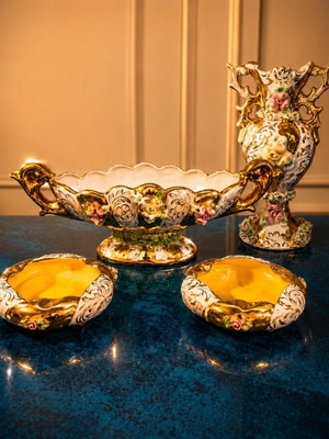 Porcelain set like new with gold details and embossed flowers