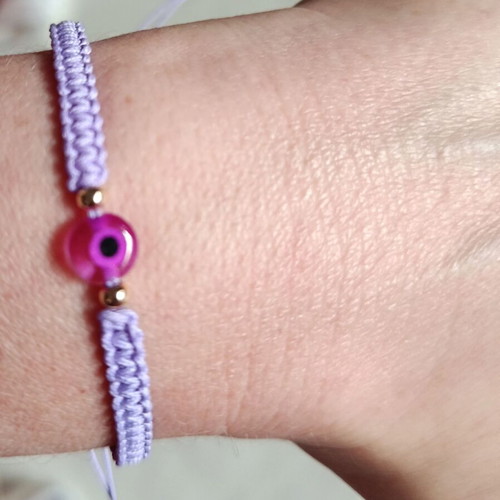 Woven bracelet with eye bead in lilac and fuchsia, new