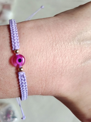 Woven bracelet with eye bead in lilac and fuchsia, new