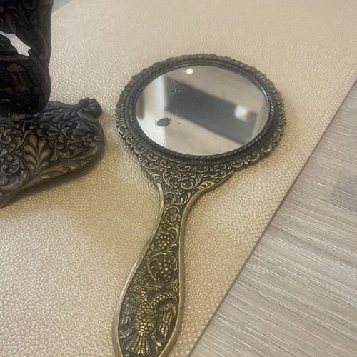 Set of two brass mirrors, table and hand used