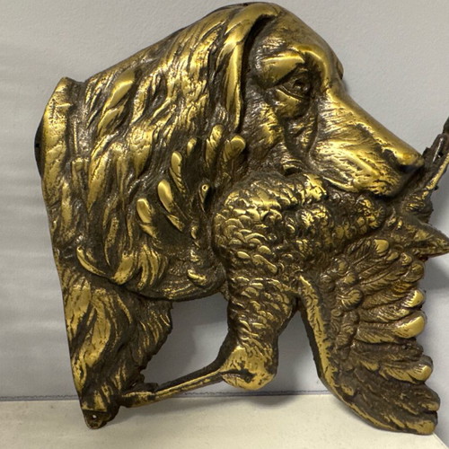 bronze hunting dog at the moment of the report