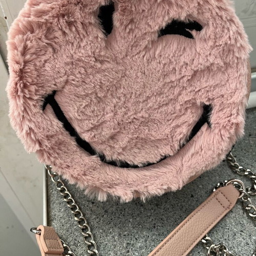 Pink round furry bag used with silver chain