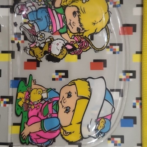 Vintage 1980s school bag with pixel pattern and girl figure