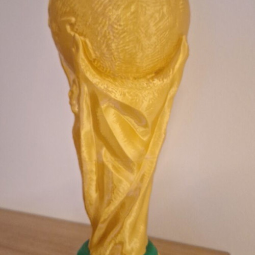 FIFA World Cup Trophy replica in gold color with green base details