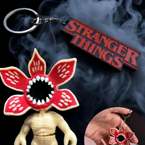 Demogorgon keychain with moving parts and Stranger Things logo like new
