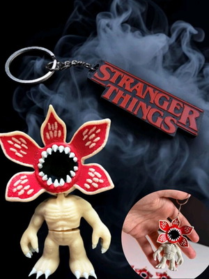 Demogorgon keychain with moving parts and Stranger Things logo like new