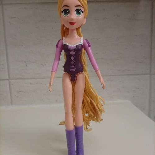 Disney Rapunzel doll with curling wand like new, missing purple dress
