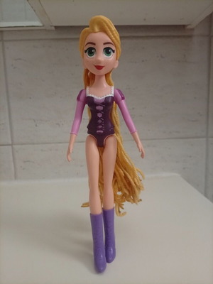 Disney Rapunzel doll with curling wand like new, missing purple dress
