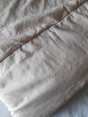 Single bed quilt used, reversible beige and red
