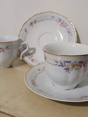 Coffee and tea cups like new, porcelain with floral and gold trim