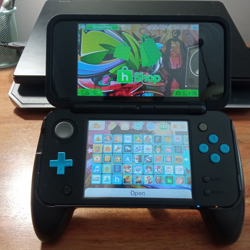 Nintendo 2DS XL modded like new with handgrip, charger, and 64GB micro SD
