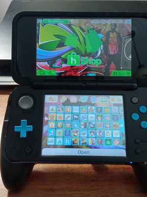 Nintendo 2DS XL modded like new with handgrip, charger, and 64GB micro SD