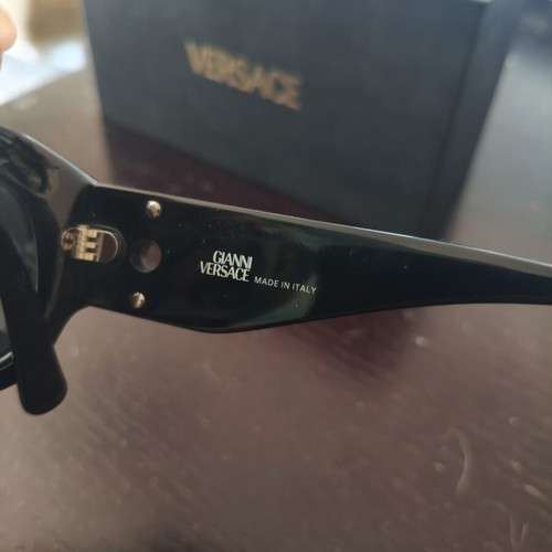 Versace collectible sunglasses, black lenses and frame