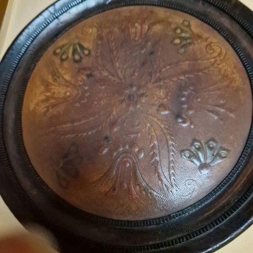 Vintage wooden wall decoration with leather center