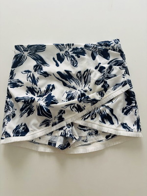 White skort with blue floral pattern