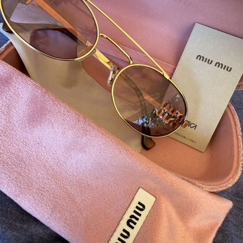 Miu Miu SMU 54ZS ZVN-70D sunglasses like new, gold frame, pink lenses