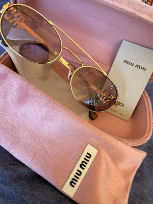 Miu Miu SMU 54ZS ZVN-70D sunglasses like new, gold frame, pink lenses
