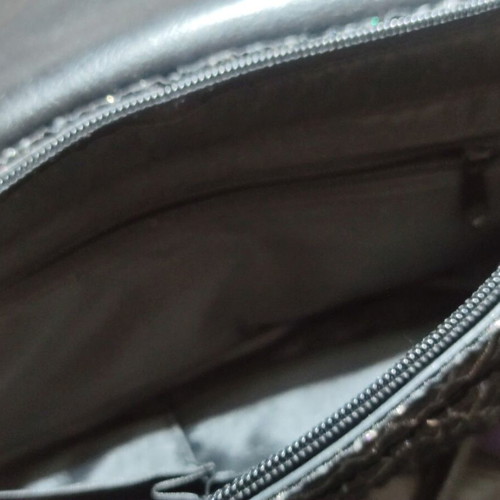 Black shoulder bag with embossed geometric pattern, like new