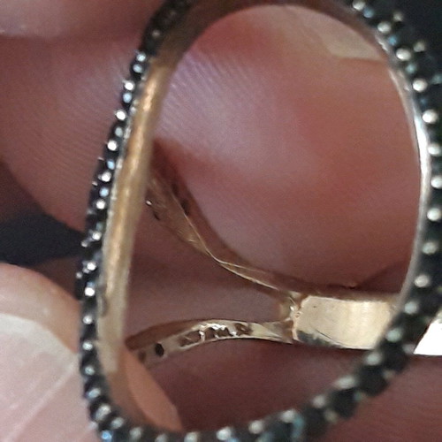 Silver set used with ring and black bracelet