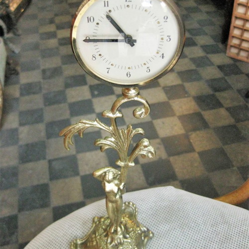 Brass tabletop clock used with decorative base